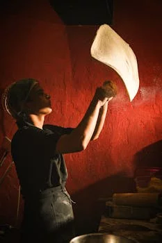 pizza chef preparing dough with passion